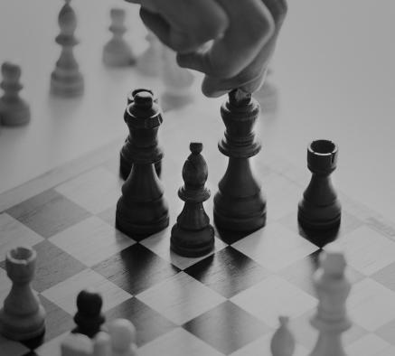 black and white photo of chess game