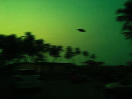 An unidentified flying object against a green background.