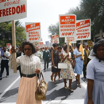 Civil rights march on Washington, D.C, 1963, people marching with signs, colorized image of a black and white photo by Warren K. Leffler.
