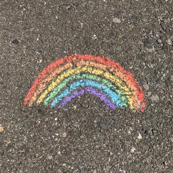 Chalk rainbow on asphalt.