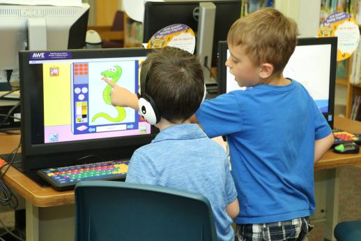 Kids use an AWE computer at the library.