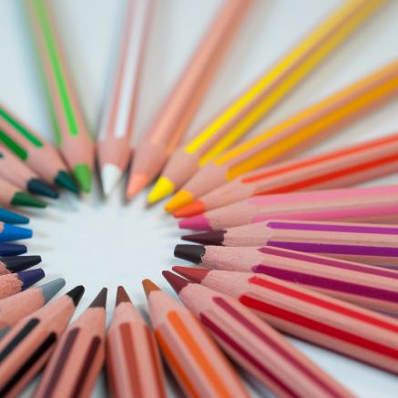 Colored pencils sit in a circle
