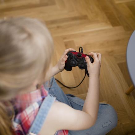 Top view of girl playing video games
