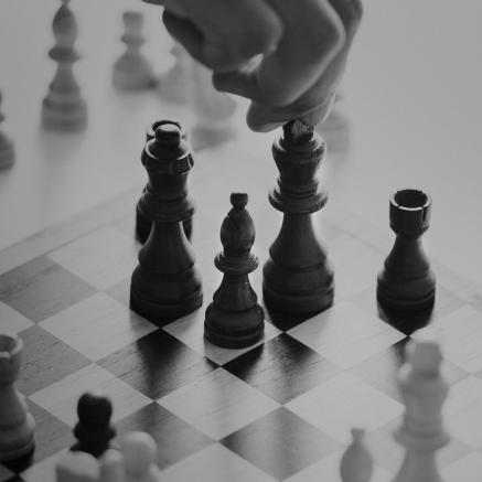 black and white photo of chess game