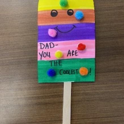 paper popsicle craft-popsicle shaped paper with a popsicle stick-rainbow colored design drawn on-for a "cool dad" on father's day, DIY father's day card for kids