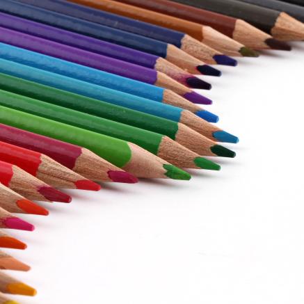 Colored pencils arranged in a curved line.