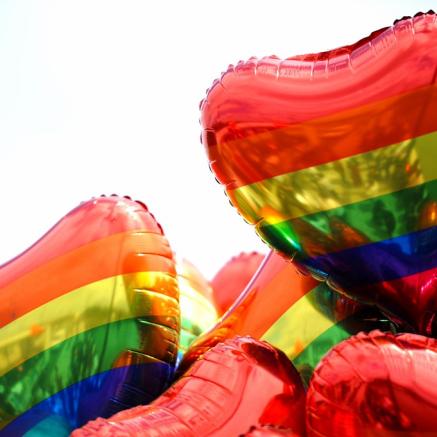 Heart shaped balloons with a rainbow