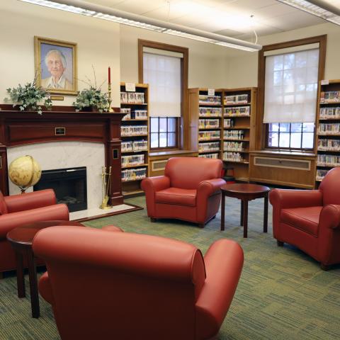 A group of comfortable chairs surround the fireplace at the historic Bordentown Library.