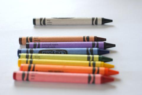A few crayons against a white background.