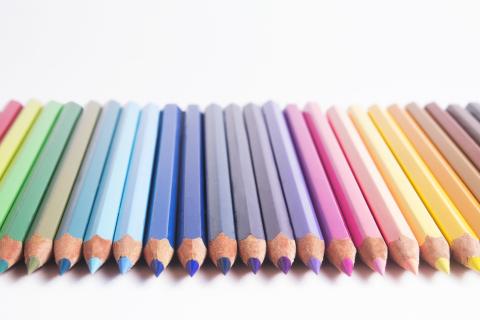 Colored pencils pointed at viewer.