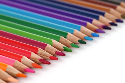 Sharpened colorful pencils lined up.