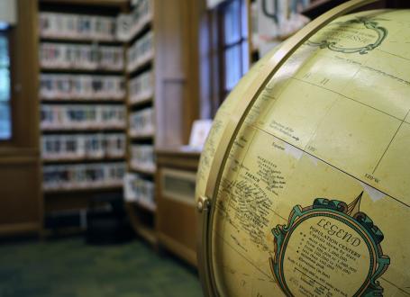 Bordentown Library features an Atlas of the World near the fireplace.