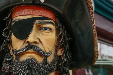 A carving of a pirate's face with an eyepatch