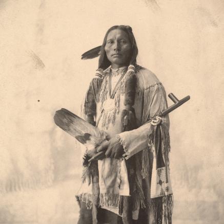 A Native American man has his portrait taken