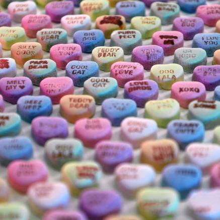 Conversation hearts appear in rows.