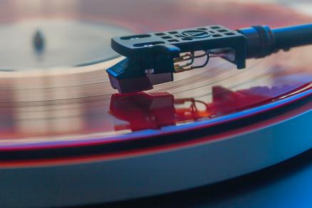 Needle of record player on vinyl record