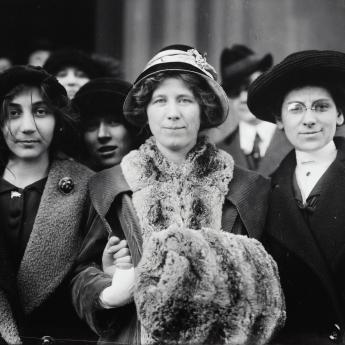 Women stand together during the Suffrage movement.