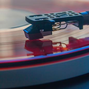 Needle of record player on vinyl record