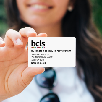 Person holding BCLS Library Card