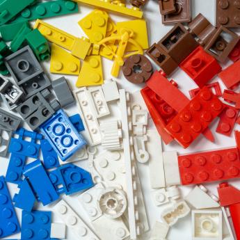 Red, grey, blue, white, yellow, brown, and red LEGO on a white background